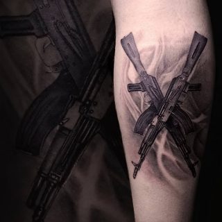 The value of the assault rifle tattoo: meaning, history, photo, sketches