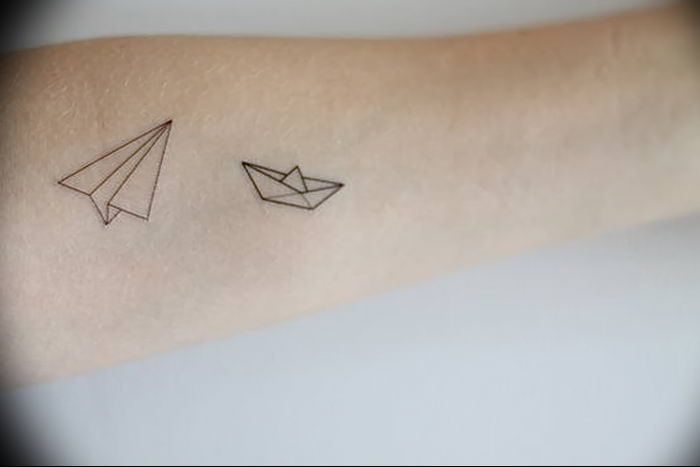 Paper Boat With Balloons And Text Tattoo On Forearm