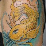 Colorful goldfish tattoo on the upper arm, featuring a fantasy aesthetic with flowing lines, delicate shading, and a whimsical expression. A unique and artistic ink idea.