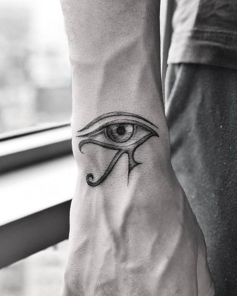 Hand and eye tattoo on the sternum  Tattoogridnet