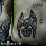photo tattoo raven on the skull 18.02.2019 №077 - tattoo with skull and raven - tattoovalue.net