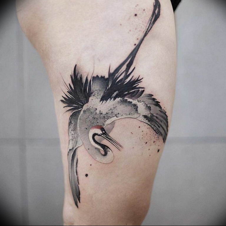 Fine line origami crane tattoo on the ankle