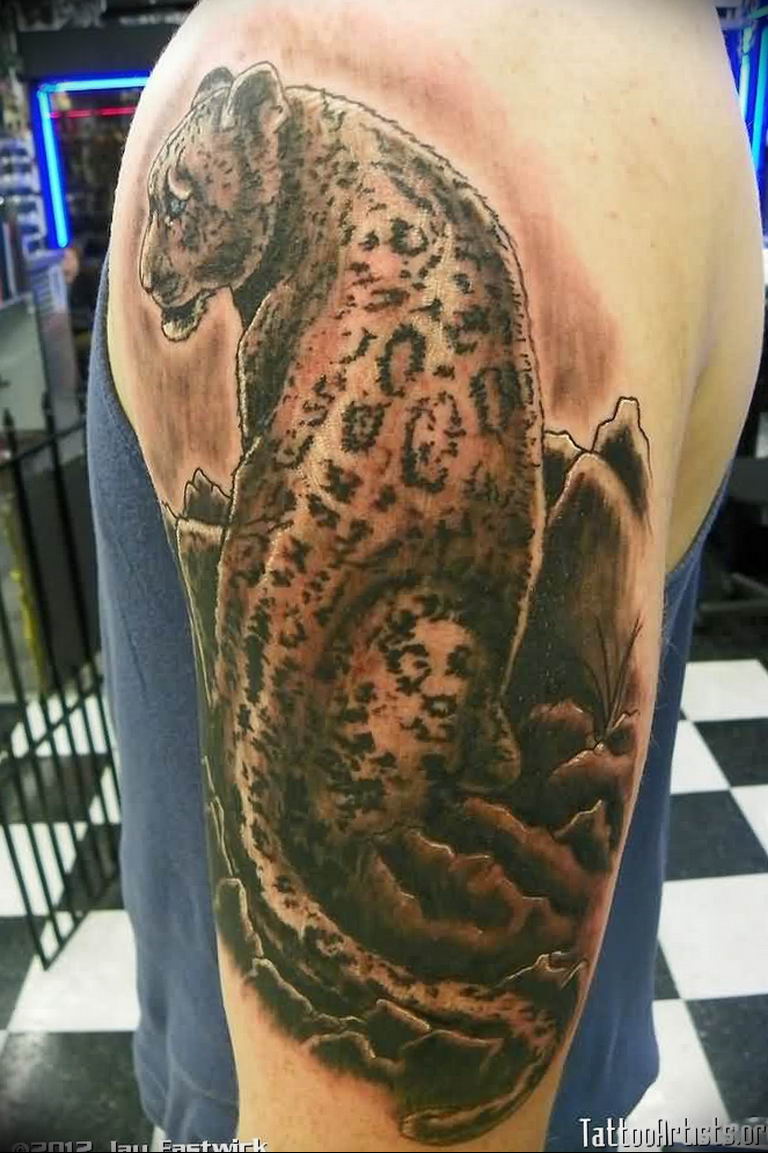 snow leopard tattoo arm