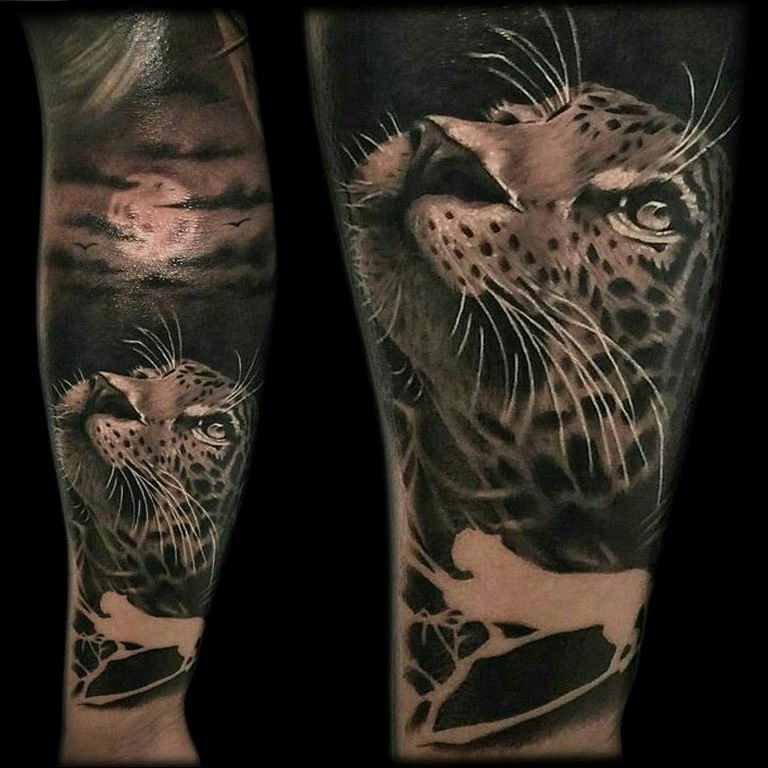 snow leopard tattoo arm