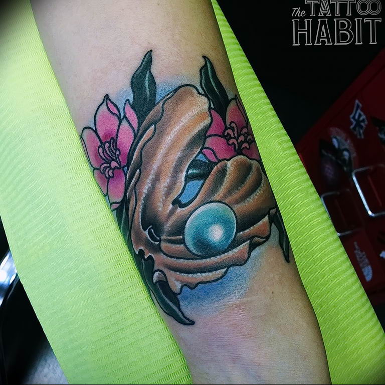 The Meaning of the Pearl Tattoo features of the picture, photo