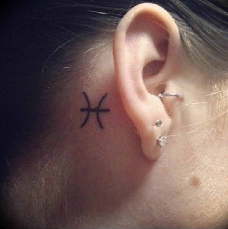 Tattoo uploaded by Juliana  Piscis tattoo two gold fish behind my ear   Tattoodo