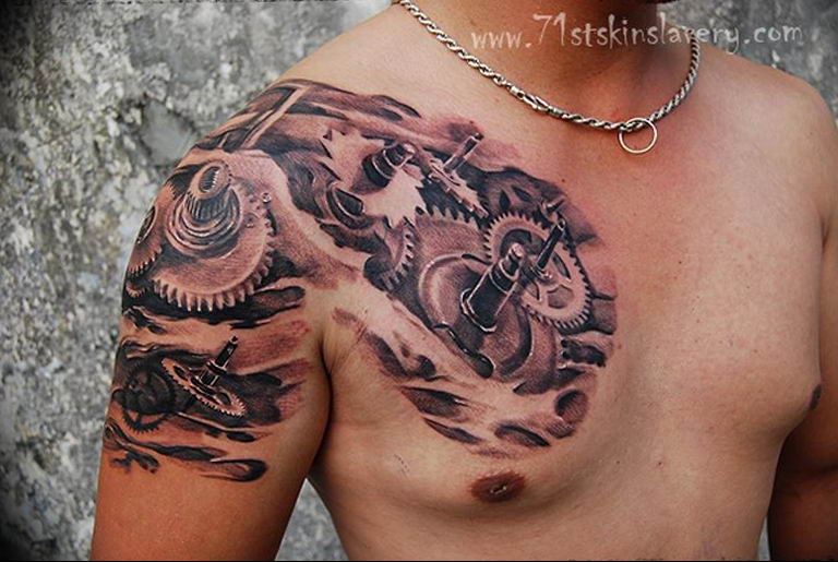 Biomechanical Tattoo On Arm And Chest