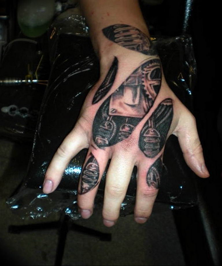 Arm Biomechanical Hand Tattoo by Tattoo by Roman