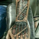 Photo tattoo biomechanics on hand 30.07.2019 №002 - biomechanics tattoo - tattoovalue.net