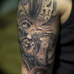 Detailed black and grey biomechanical tattoo on the upper arm, featuring gears, a clock, and metallic elements in a realistic style.