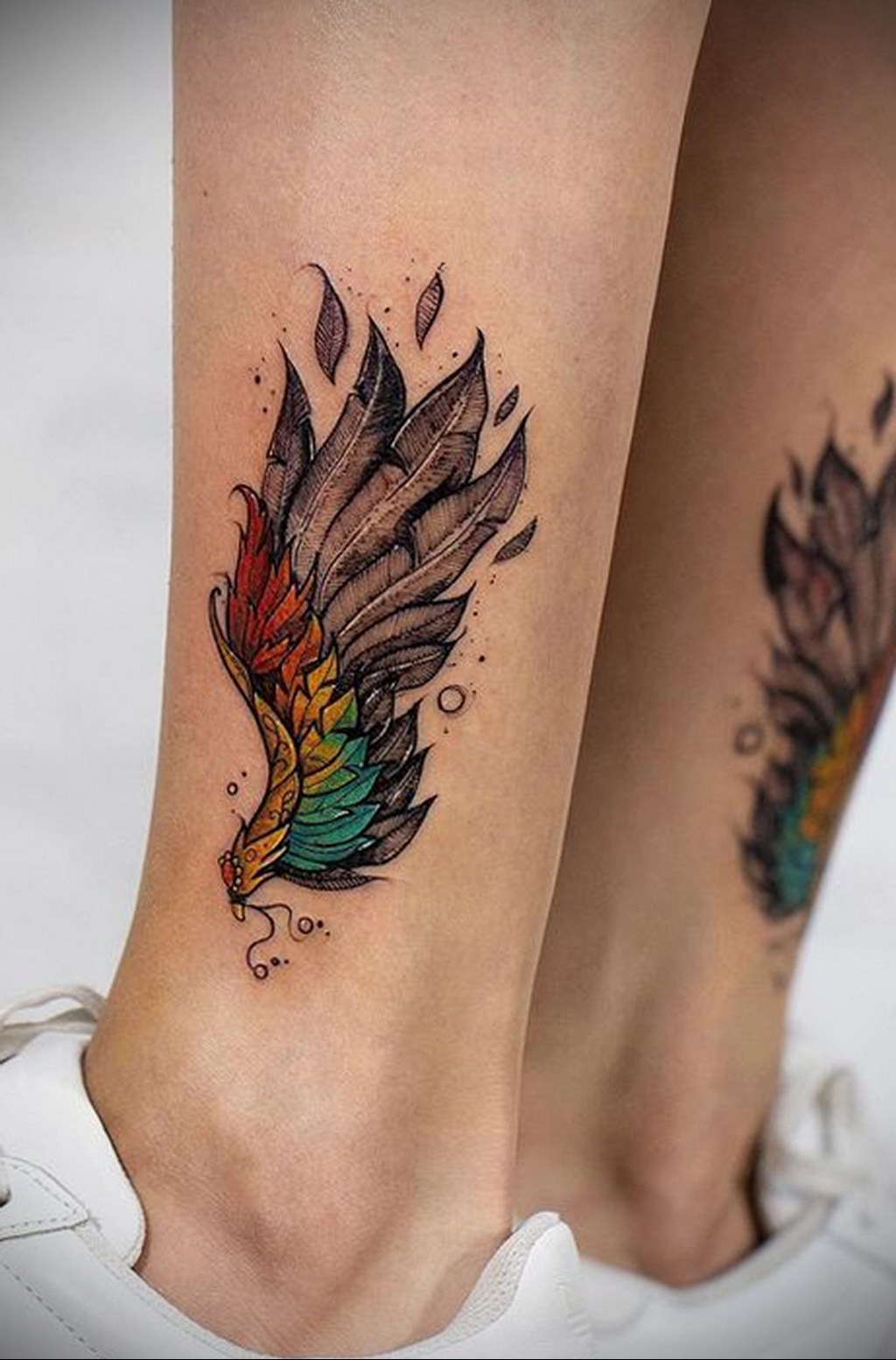 Rita Oras Ankle Tattoo of Two Wings PopStarTats