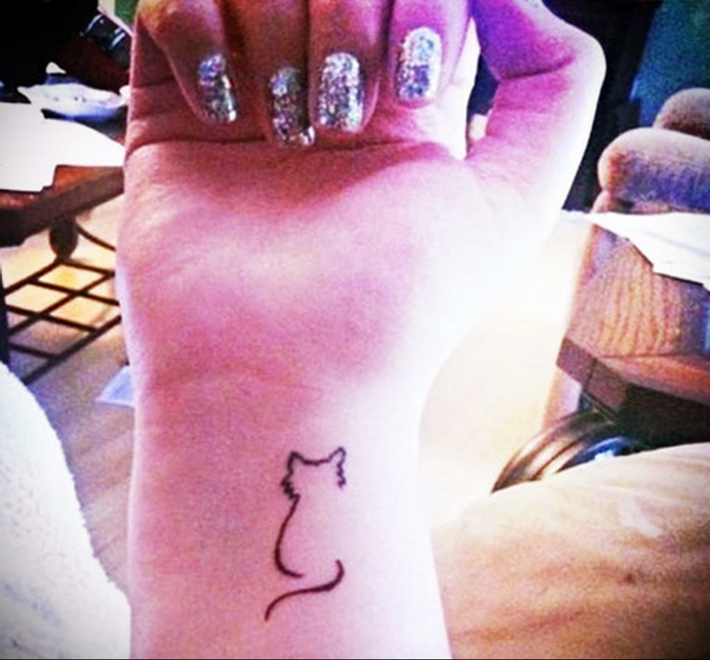 cat tattoo on the wrist 03.12.2019 №016 -cat tattoo- tattoovalue.net