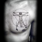 Fine-line blackwork tattoo of Leonardo da Vinci's Vitruvian Man on the chest, with added arrow motifs. Minimalist and anatomical design.