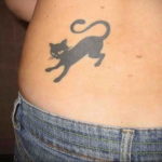 tattoo cat on the lower back 03.12.2019 №007 -cat tattoo- tattoovalue.net