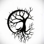 Bold blackwork tattoo of a bare Tree of Life within a circle, featuring a black cat at the base on the skin. Symbolic, dark aesthetic.