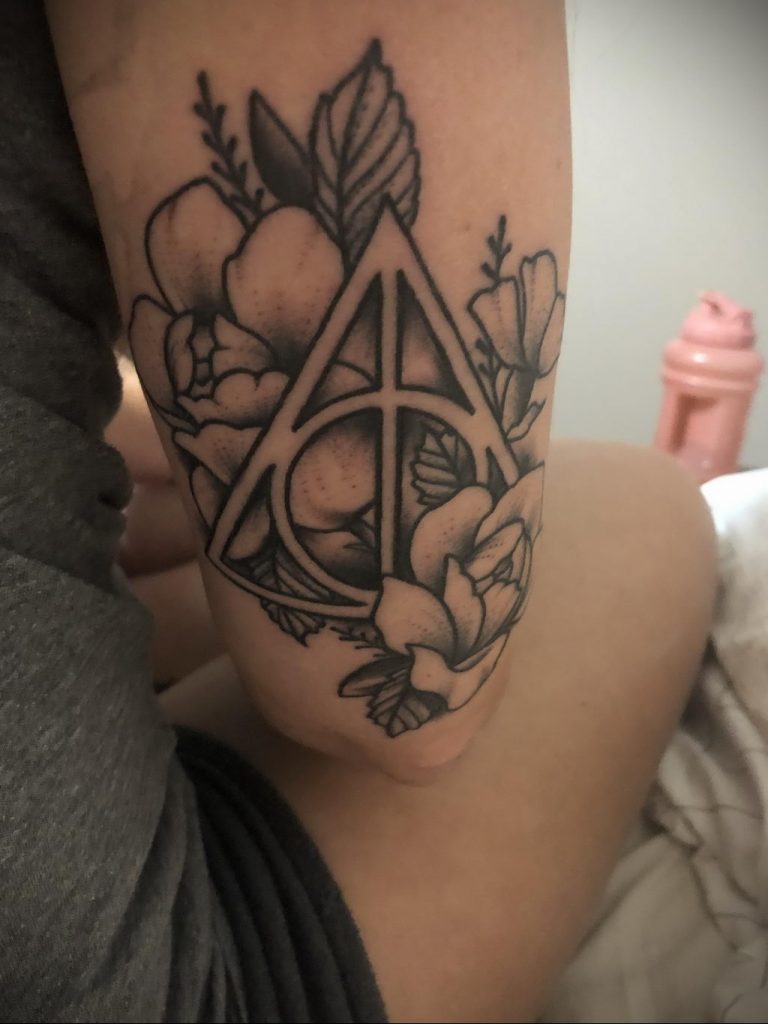 Meaning of the deathly hallows tattoo features, photo examples of