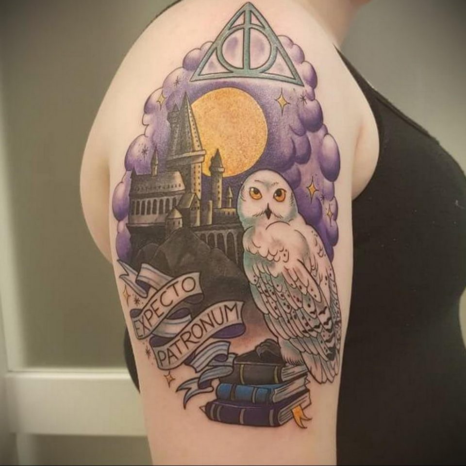 Meaning of the deathly hallows tattoo features, photo