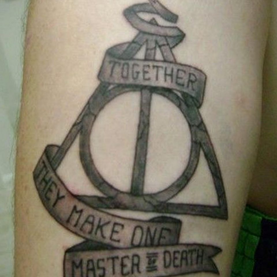 Meaning of the deathly hallows tattoo features, photo