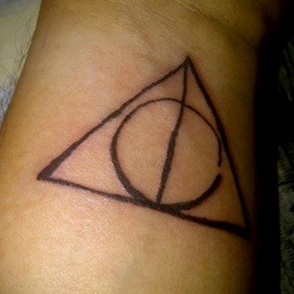 Meaning of the deathly hallows tattoo features, photo