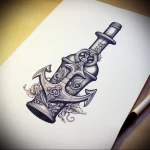 Intricate black and grey sketch of an anchor inside a bottle, adorned with roses and foliage, ideal for a sleeve.