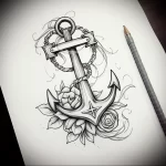 Black and grey tattoo sketch featuring an anchor intertwined with roses, showcasing detailed shading and a romantic aesthetic, ideal for a shoulder or back piece.