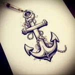 Blackwork tattoo sketch of a classic anchor with a chain, accompanied by an ink bottle, representing the art of tattooing. Ideal for a forearm or calf.