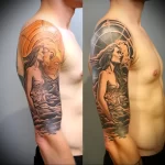 Black and grey realism tattoo on the upper arm, depicting a couple embracing against a backdrop of clouds and a celestial sphere.