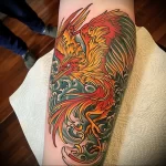 What are the best ink colors for tattoos - A detailed multicolored phoenix tattoo on someones a a dcefb - 030124 tattoovalue.net 034