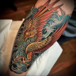 What are the best ink colors for tattoos - A detailed multicolored phoenix tattoo on someones a a dcefb _1_2 - 030124 tattoovalue.net 036