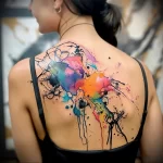 What are the best ink colors for tattoos - A lady with an abstract tattoo featuring splashes of daf a f dbaab _1 - 030124 tattoovalue.net 078