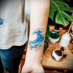 What are the best ink colors for tattoos - A person showing off their blue ocean themed tattoo de c de a adbbeba - 030124 tattoovalue.net 129