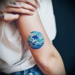 What are the best ink colors for tattoos - A person showing off their blue ocean themed tattoo de c de a adbbeba _1 - 030124 tattoovalue.net 130
