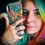 What are the best ink colors for tattoos - A person taking a selfie with their new vibrant tatt fef e de fbbf - 030124 tattoovalue.net 132