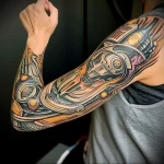 What are the best ink colors for tattoos - A person with a biomechanical tattoo with metallic c f fb b bb baccd - 030124 tattoovalue.net 134