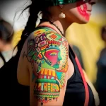 What are the best ink colors for tattoos - A person with a colorful cultural themed tattoo s ebf f ca aa dced _1 - 030124 tattoovalue.net 139