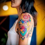 What are the best ink colors for tattoos - A person with a colorful cultural themed tattoo s ebf f ca aa dced _1_2 - 030124 tattoovalue.net 140