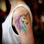 What are the best ink colors for tattoos - A person with a pastel colored tattoo of a unicorn b ad f cc adadfda _1 - 030124 tattoovalue.net 148