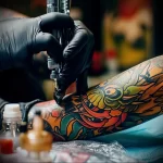 What are the best ink colors for tattoos - A tattoo artist applying a colorful tattoo with prec dbc fd d bfc aadc - 030124 tattoovalue.net 180