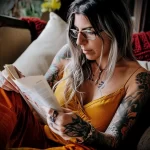 What are the best ink colors for tattoos - A woman reading a guide about caring for colorful ta b ed c bfcade _1 - 030124 tattoovalue.net 254