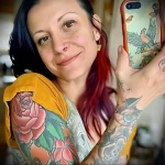 What are the best ink colors for tattoos - A woman taking a selfie with her newly inked colorfu ced a a ceed - 030124 tattoovalue.net 266