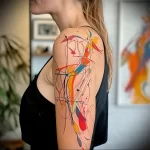 What are the best ink colors for tattoos - A woman with a bright artistic abstract tattoo on he abaabd f cb bacbaa - 030124 tattoovalue.net 268