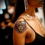 What are the best ink colors for tattoos - A woman with a sleek black panther tattoo style r ca e bc cad _1_2 - 030124 tattoovalue.net 289