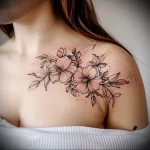 What are the best ink colors for tattoos - A woman with a soft pink floral tattoo style raw be f ef cf _1_2 - 030124 tattoovalue.net 297