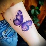 What are the best ink colors for tattoos - An individual with a bright purple butterfly tattoo f dd ad f - 030124 tattoovalue.net 324