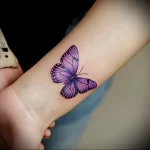 What are the best ink colors for tattoos - An individual with a bright purple butterfly tattoo f dd ad f _1 - 030124 tattoovalue.net 325