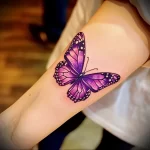 What are the best ink colors for tattoos - An individual with a bright purple butterfly tattoo f dd ad f _1_2_3 - 030124 tattoovalue.net 327