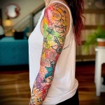 What are the best ink colors for tattoos - Someone revealing a colorful sleeve tattoo with vari ace ad fc b edfbe _1 - 030124 tattoovalue.net 364
