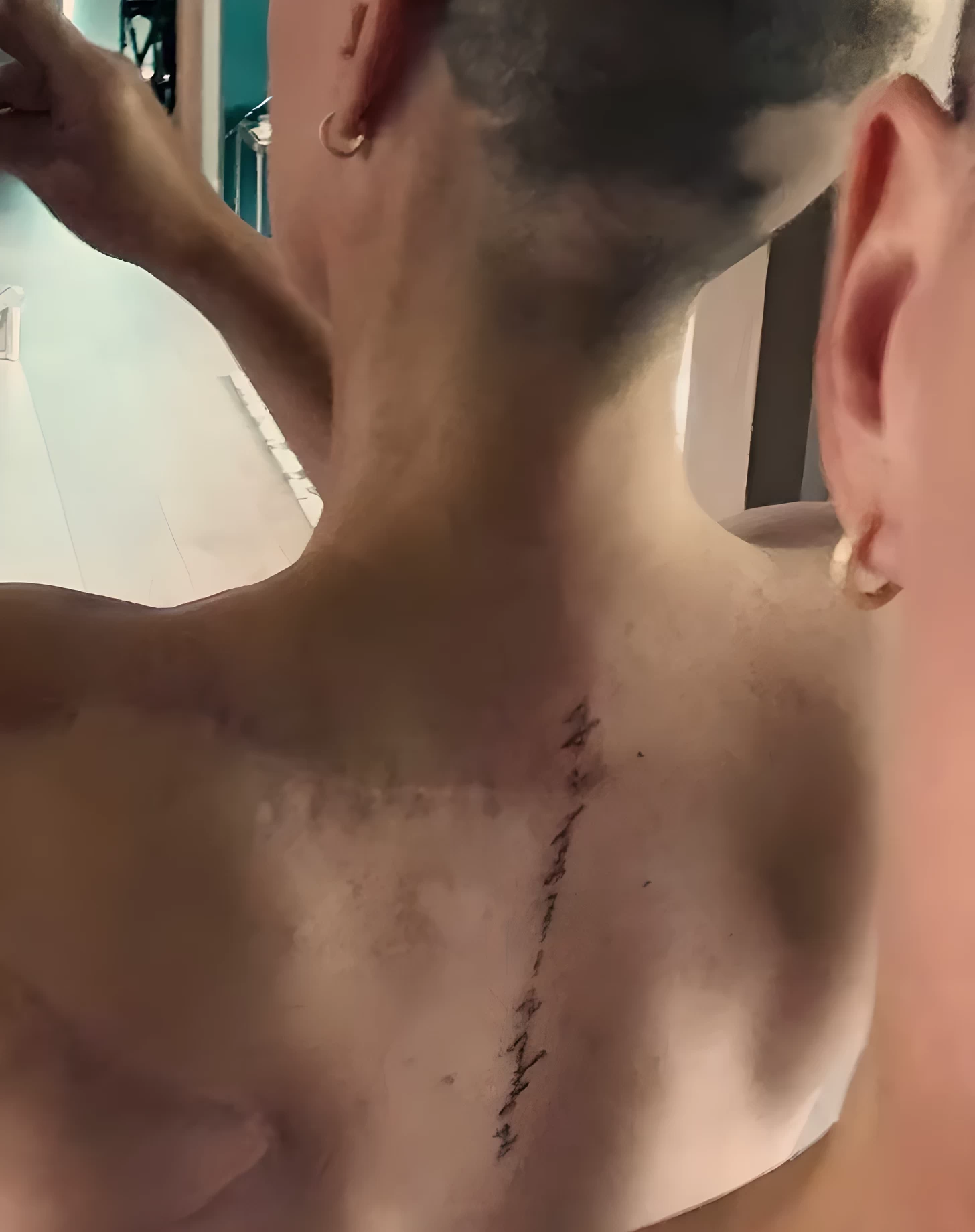 Teddi Mellencamp Honors Her Father with a New Spine Tattoo over a Sur №02 - tattoovalue.net