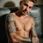 Black and grey sleeve tattoo featuring a combination of realistic roses and geometric patterns. Intricate shading and detailed linework create a visually stunning design on the arm.